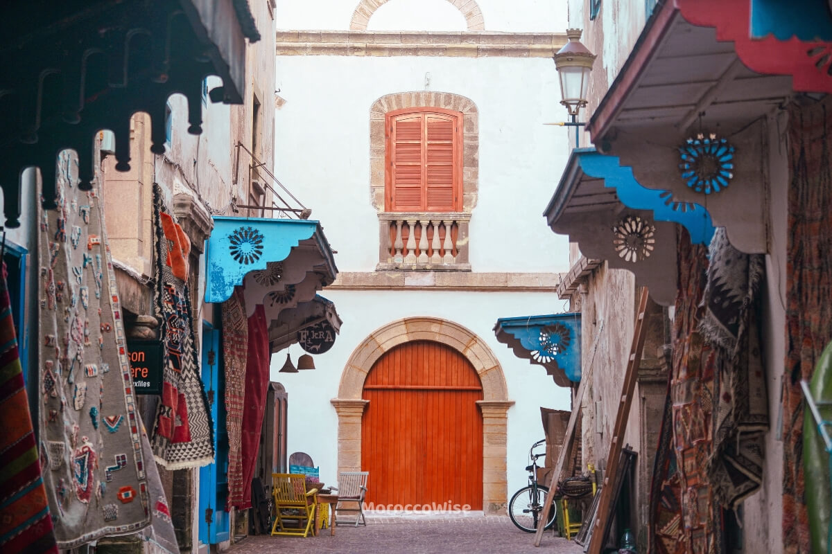 Cafe tables in a historic Tangier medina square